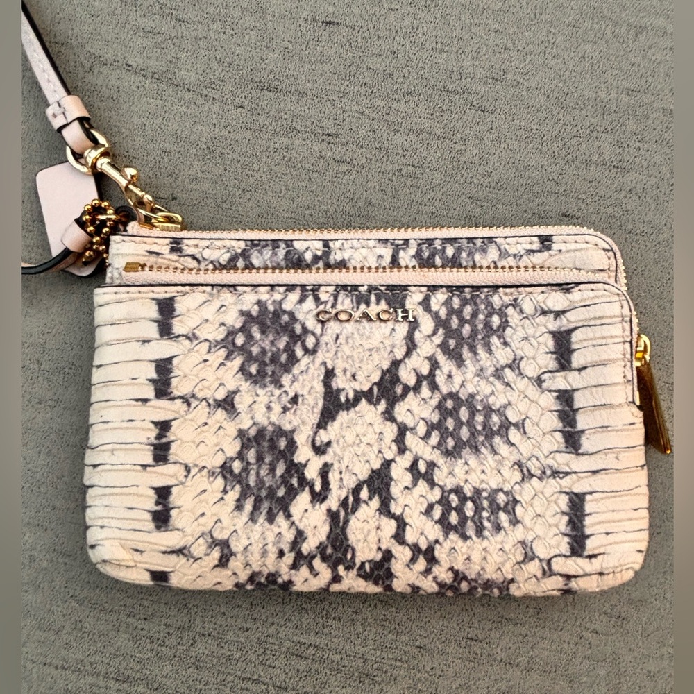 Coach wristlet, 2 compartments, faux python, white & black. Used once